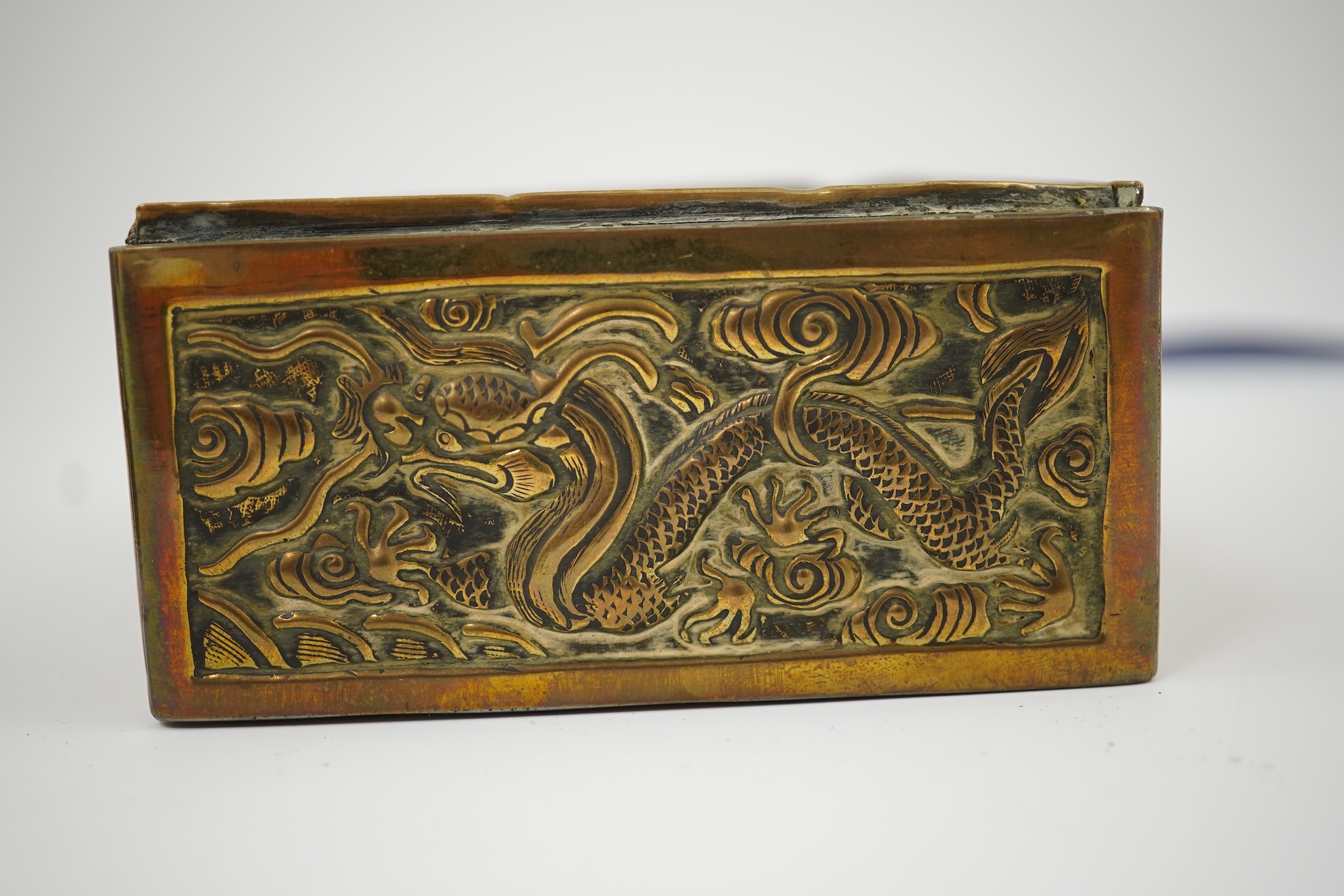 A Chinese brass 'dragon' box, inset with a 17th/18th century jade plaque